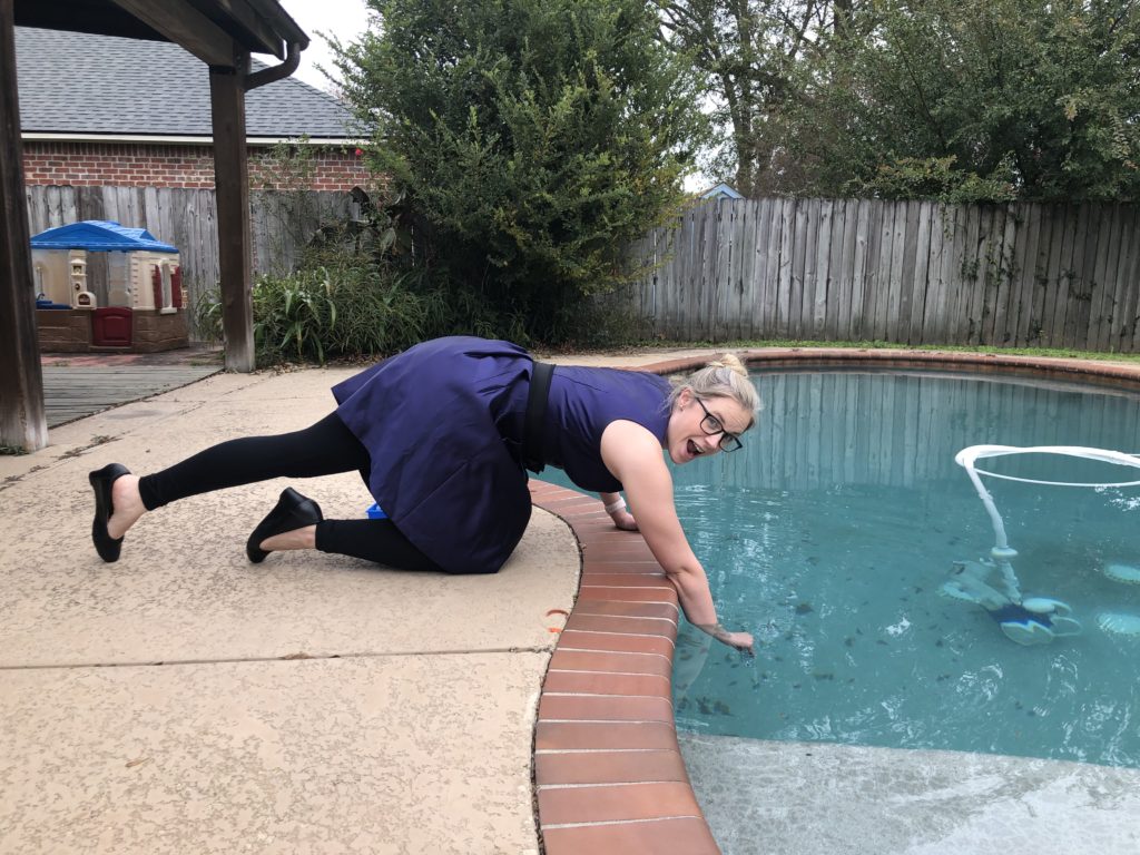 woman cleaning pool