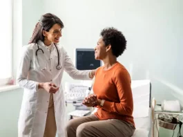 iStock photo - Female medical practitioner reassuring a patient stock photo